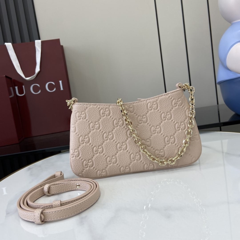 G*u*i clutch bags